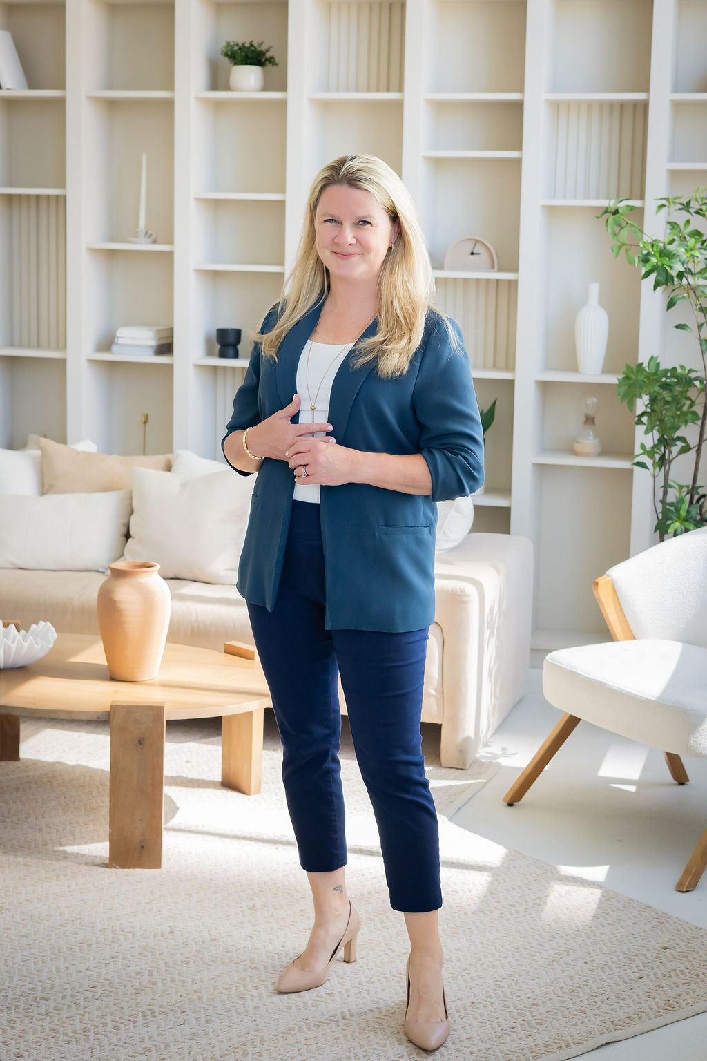 Sarah Claydon in a teal blazer
